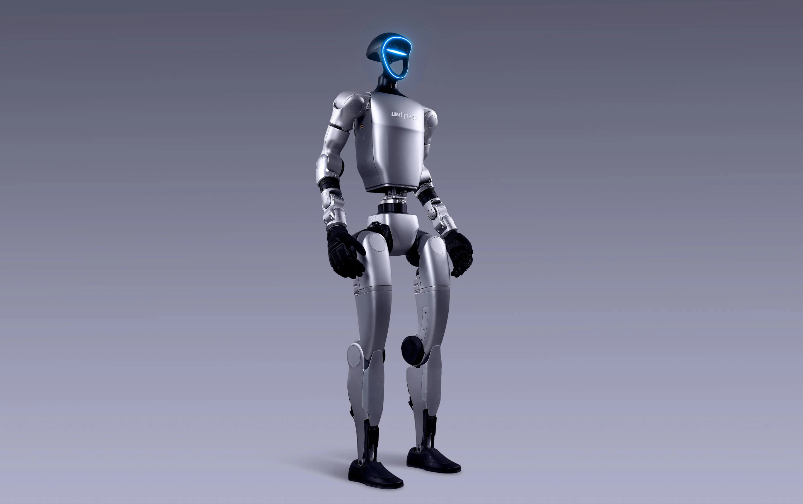 Robot humanoïde Unitree G1 de 1,32 m debout en studio sur fond gris : la version standard vendue 22 500 € hors taxes en Europe